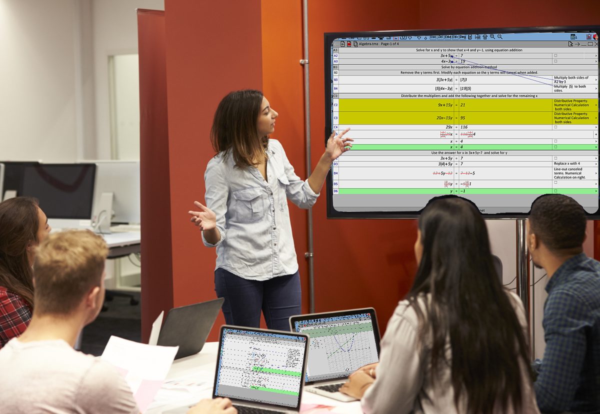A teacher presenting a solution from The Math App on a classroom screen while students work on laptops